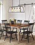 Crayton Amish Dining Collection featuring a Brown Maple dining table with an Almond stain top and Weathered Tusk stain base. The set includes six RH Yoder Crayton chairs in Black paint, all set in a bright and airy dining room with a rustic-modern aesthetic.