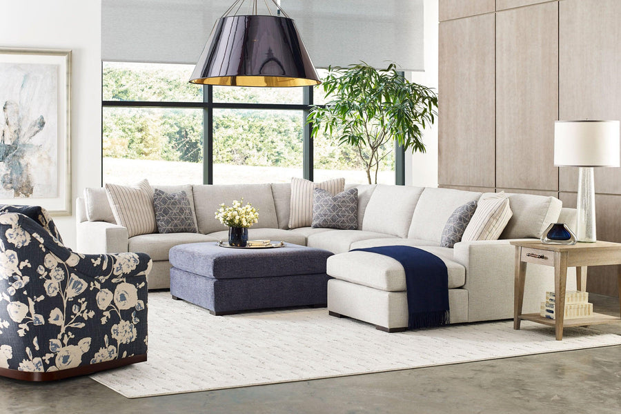 Sectional Sofa in Living Room Furniture Setting with End Tables and Ottoman