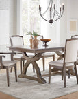 Carmen Dining Set featuring the Carmen table with black finish and Palmer chairs in a bright dining room setting.